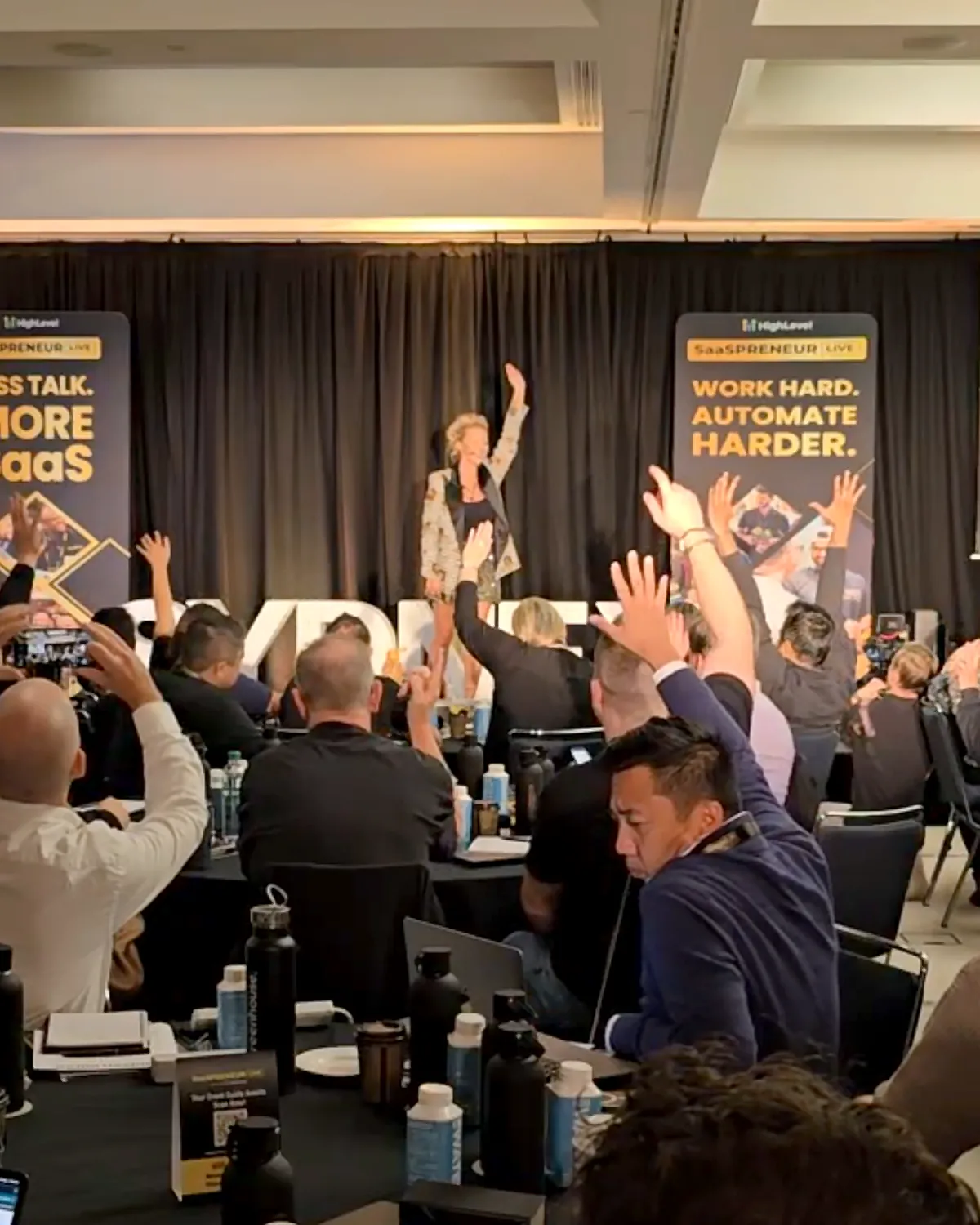 Sarah Cordiner keynote in Sydney with the audience's hands up